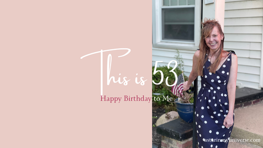 woman standing, smiling "This is 53"