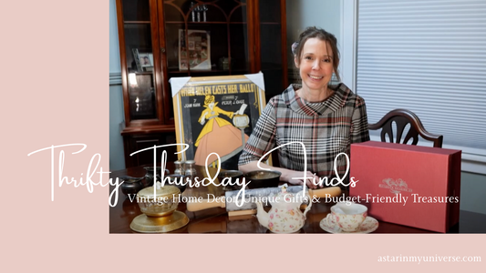 woman sitting at table with vintage teapot, print, and candy dish